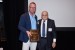 Dr. Nagib Callaos, General Chair, giving Prof. Martin Gellerstedt a plaque "In Appreciation for Delivering a Great Keynote Address at a Plenary Session."